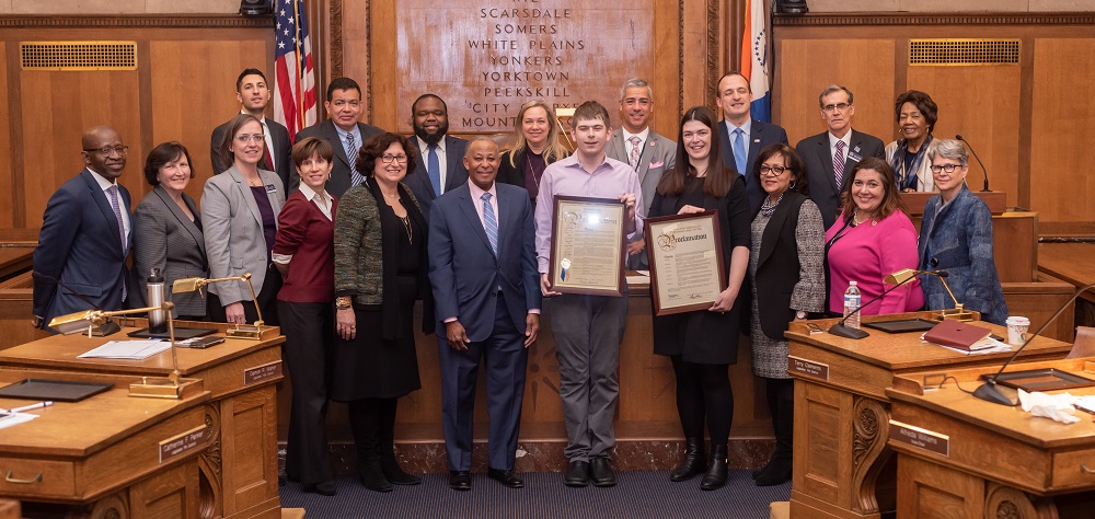 Legislators pose with Wolf Cukier after presenting proclamation
