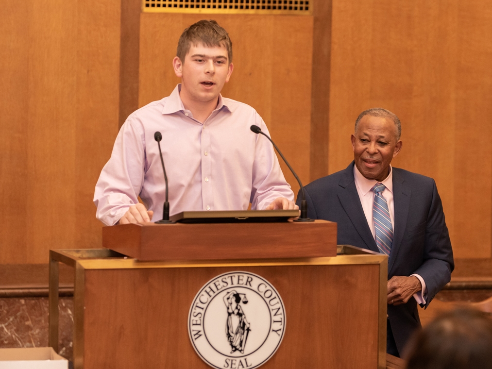 Wolf Cukier speaks at podium