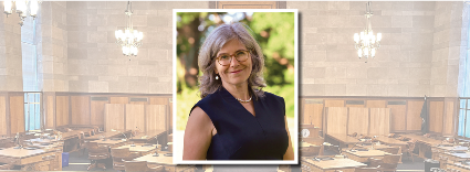 Legislator Erika Pierce headshot with Board Chamber in background.